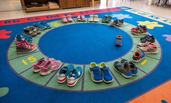 children's shoes lined up in a circle