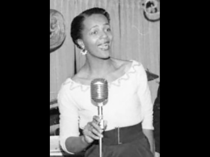 Image 2: Historical black and white headshot of Eleanor Collins smiling and holding microphone.