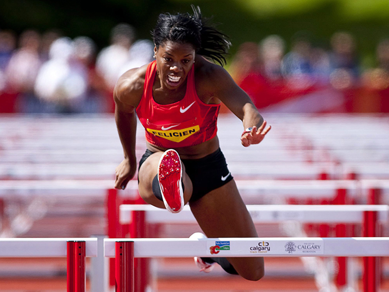 Image 5: Photo of Perdita Felicien in mid-air, running hurdles.