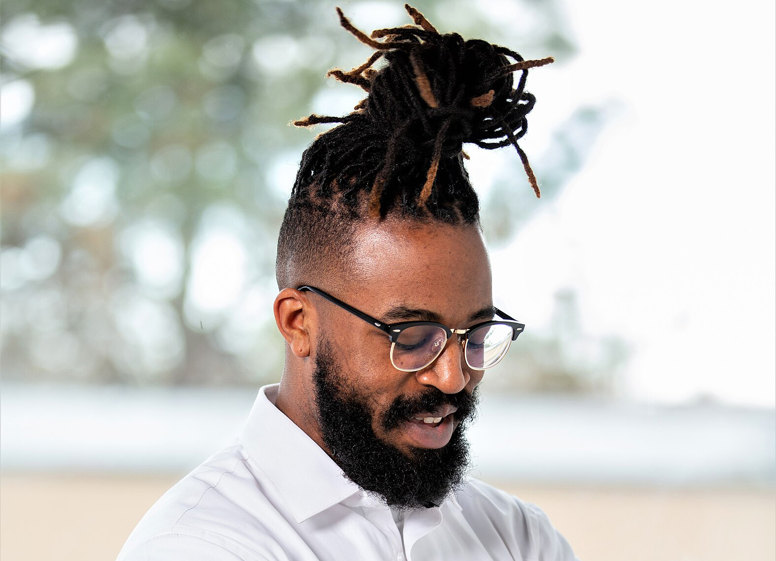 image 7: Professional man with glasses and dreadlocks